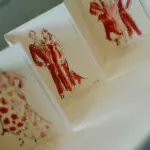 Photo of red drawings (decord details) of the guests, at an elegant wedding planned by Yiventful Co. at MacArthur Place Hotel, Sonoma.